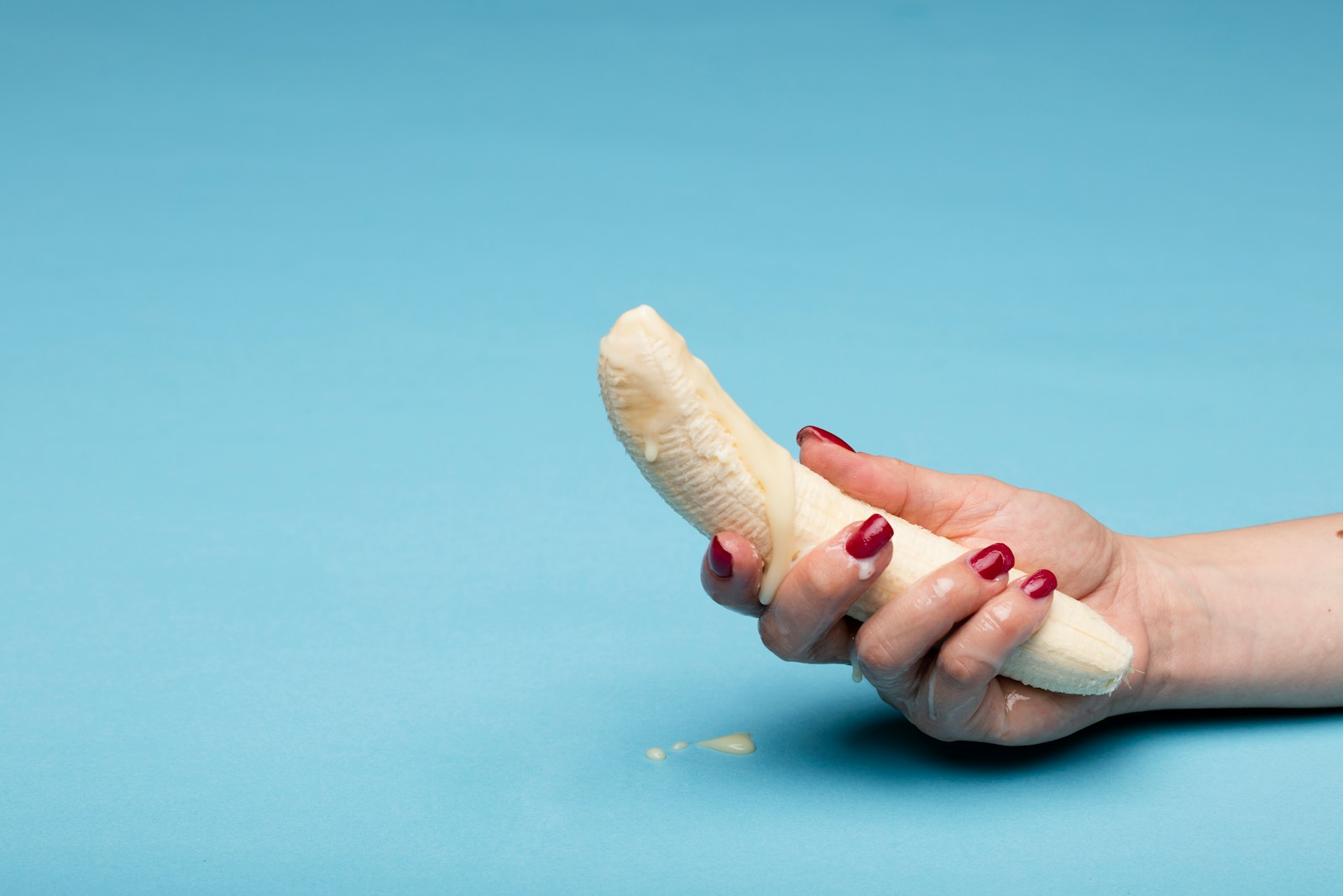 person holding white seashell during daytime