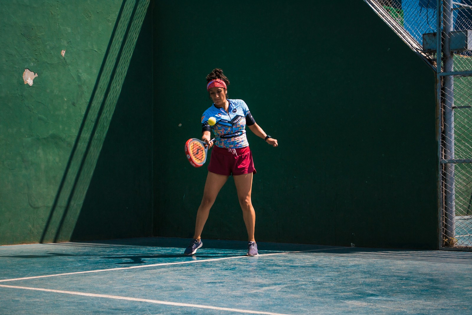 a female tennis player in action on the court