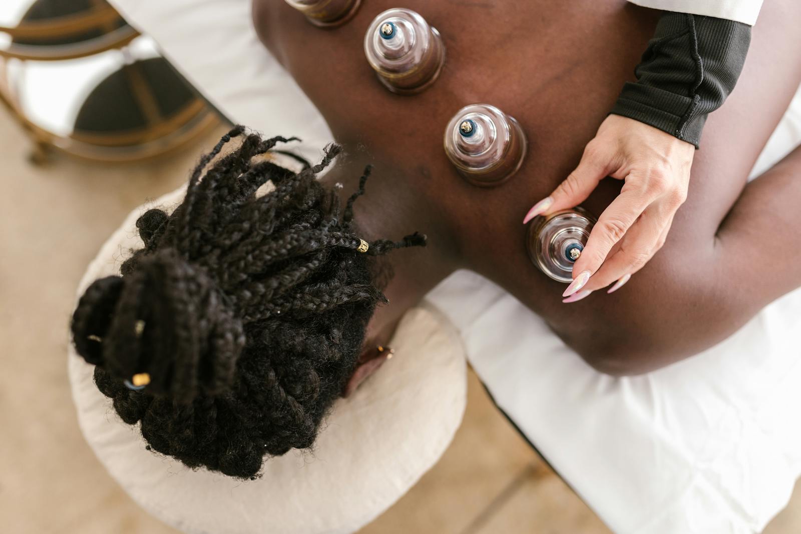 A person receiving cupping therapy for holistic wellness in a spa setting.